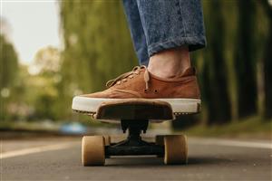 Feet on skateboard